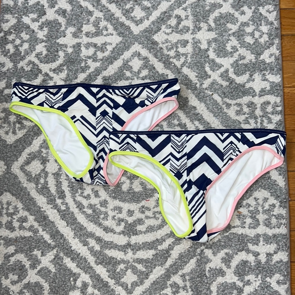 two pairs of Victoria secret bikini bottoms
